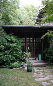 Exterior screen porch of a private residence in East Hampton designed by Steven Elmets Architecture