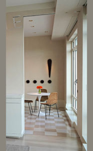 view from the dining room to the kitchen in an art collector's apartment at the Mandarin Oriental in Boston, designed by Steven Elmets Architecture