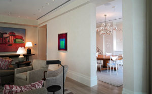 living room to dining room in an art collector's apartment at the Mandarin Oriental in Boston, designed by Steven Elmets Architecture