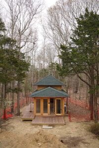 Elevated View of wooden Exercise Pavilion in the woods for a private residence in East Hampton, designed by Steven Elmets Architecture