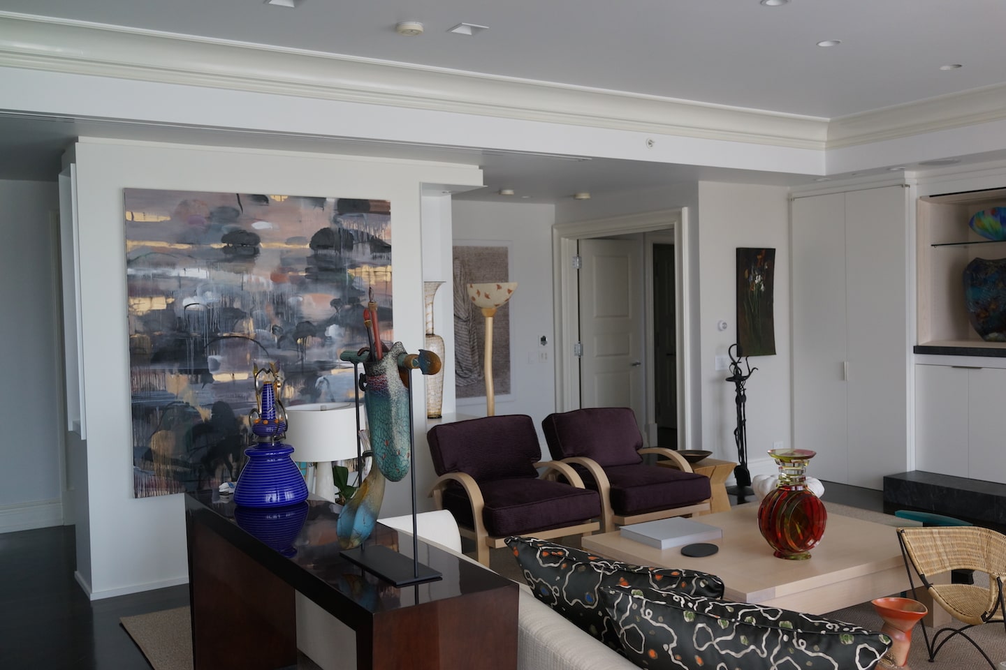 Living room in a glass collector's apartment in the Mandarin Oriental, designed by Steven Elmets Architecture