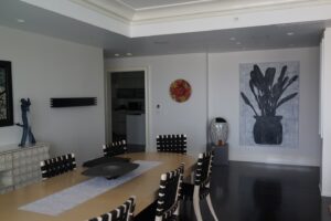 Dining area in a glass collector's apartment in the Mandarin Oriental, designed by Steven Elmets Architecture