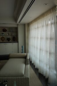 Curtain details in a glass collector's apartment in the Mandarin Oriental, designed by Steven Elmets Architecture