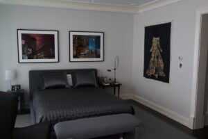 Bedroom in a glass collector's apartment in the Mandarin Oriental, designed by Steven Elmets Architecture