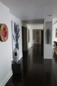 Hallway in a glass collector's apartment in the Mandarin Oriental, designed by Steven Elmets Architecture