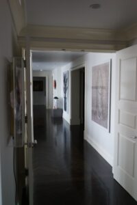 Hallway in a glass collector's apartment in the Mandarin Oriental, designed by Steven Elmets Architecture