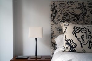 Headboard detail in a bedroom of an apartment at 15 Central Park West, NYC designed by Steven Elmets Architecture